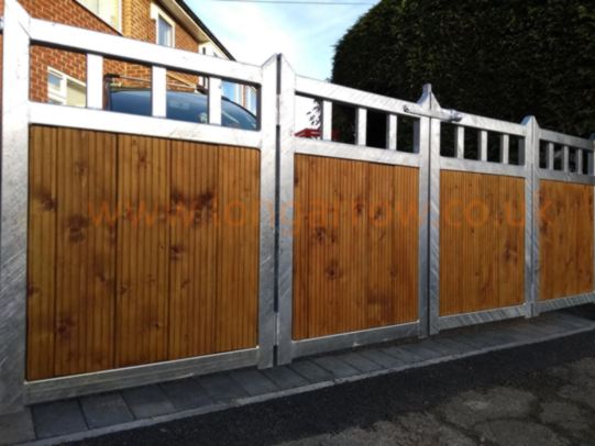 Galvanized metal frame and wood infill driveway bifold gate Leeds