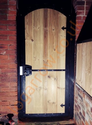 arched wood infill metal gate 