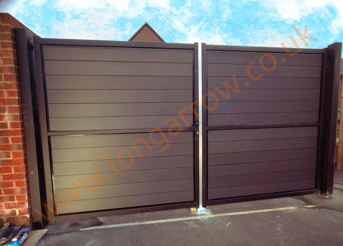 Double swing metal framed gate, charcoal boards placed horizontally, contemporary design
