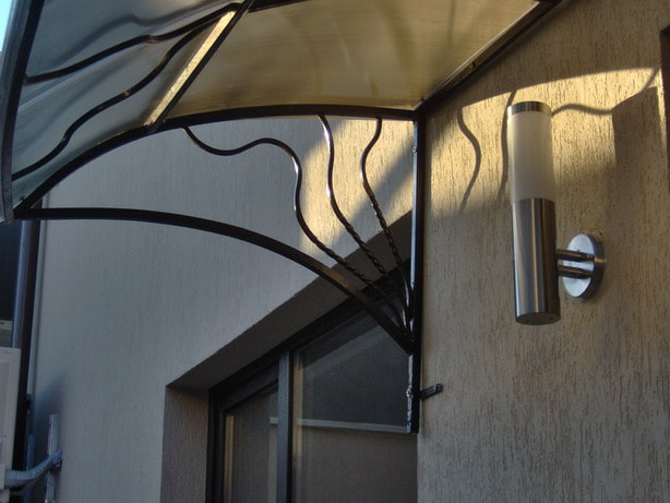 wrought iron art door canopy
