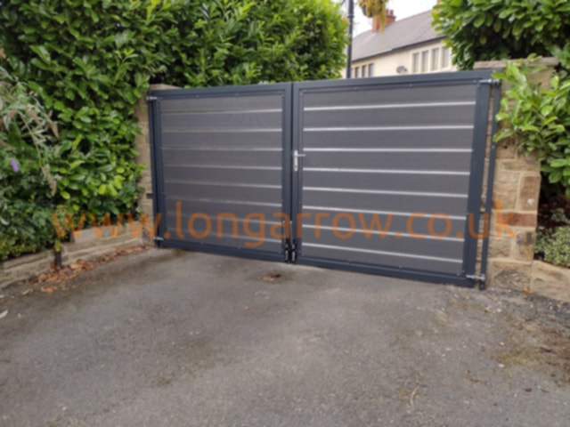 Metal gate with composite infill - anthracite grey with aluminium stripes
