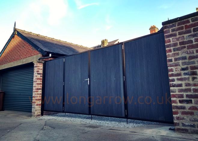 Double bifold metal&composite driveway gate fitted in Tadcaster