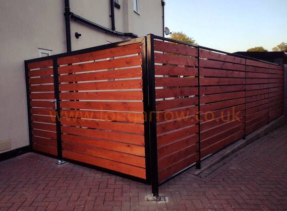 metal fencing with horizontal wood boars infill