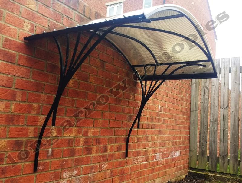 arched wrought iron canopy - rain gutter on sides