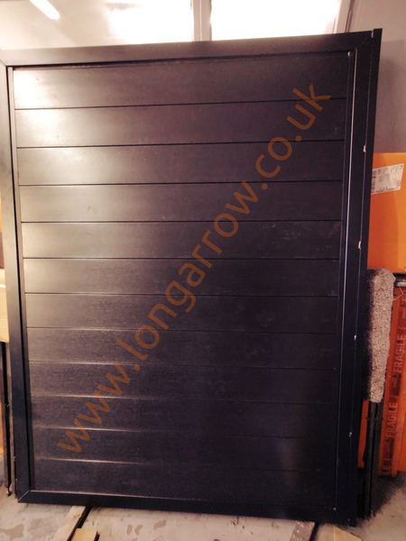 metal frame gate with black composite wood infill fabrication