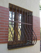 Curved Wrought Iron Security Grille Installation